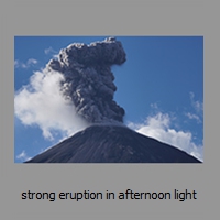 strong eruption in afternoon light